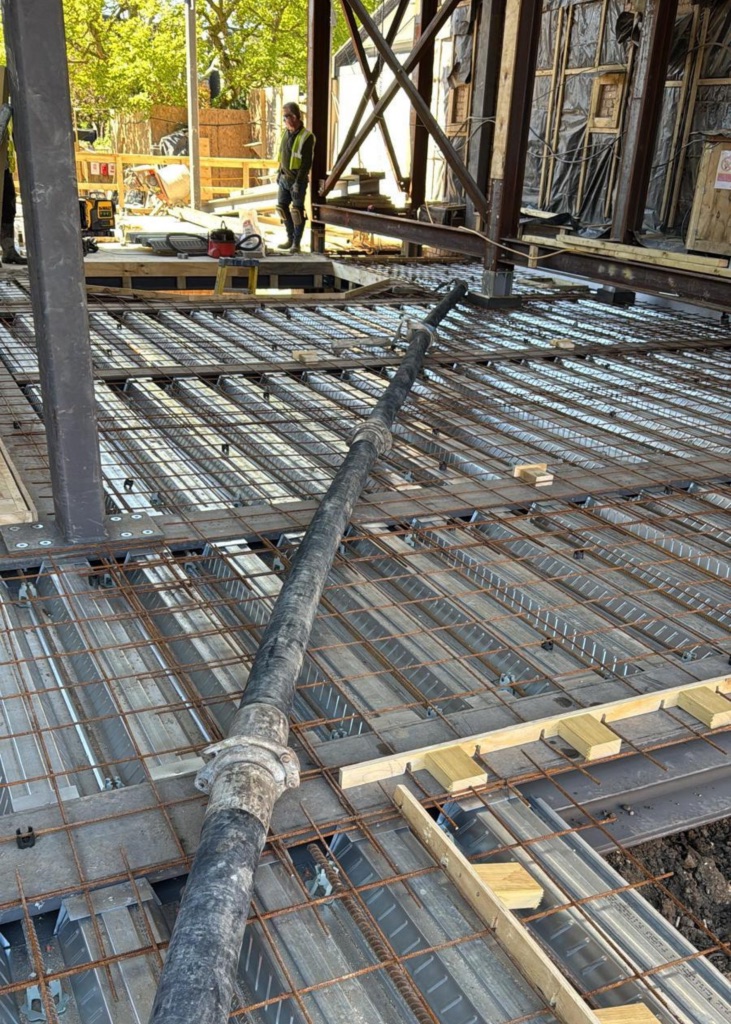A King Concrete Pumping line pump feeding concrete on site near Brighton